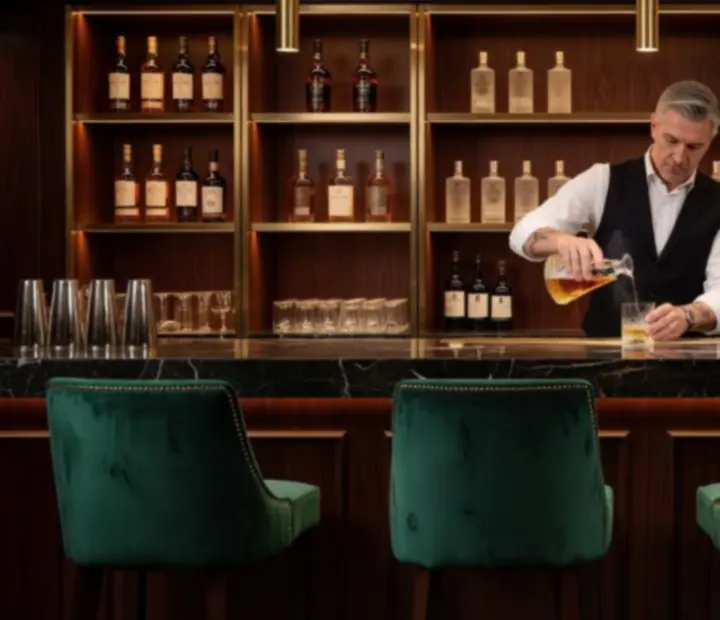 Signature cocktail bar at Wonderstar s. r. o. with emerald velvet and gold details